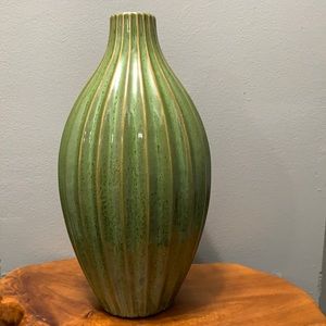 Green and gold striped vase.